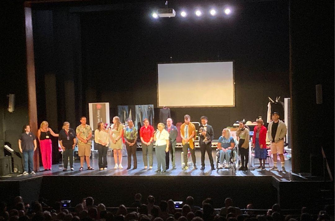 A photo of the cast of Belongings taking a bow and Commissioner Gill Cotterill thanking them