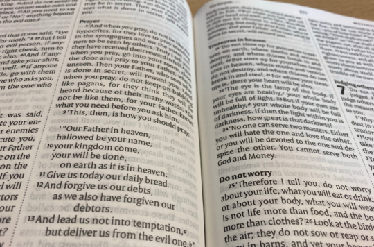 A photo of a Bible open at Matthew 6:9-13