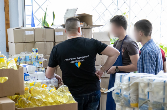 Volunteers in Ukraine sort donations of food