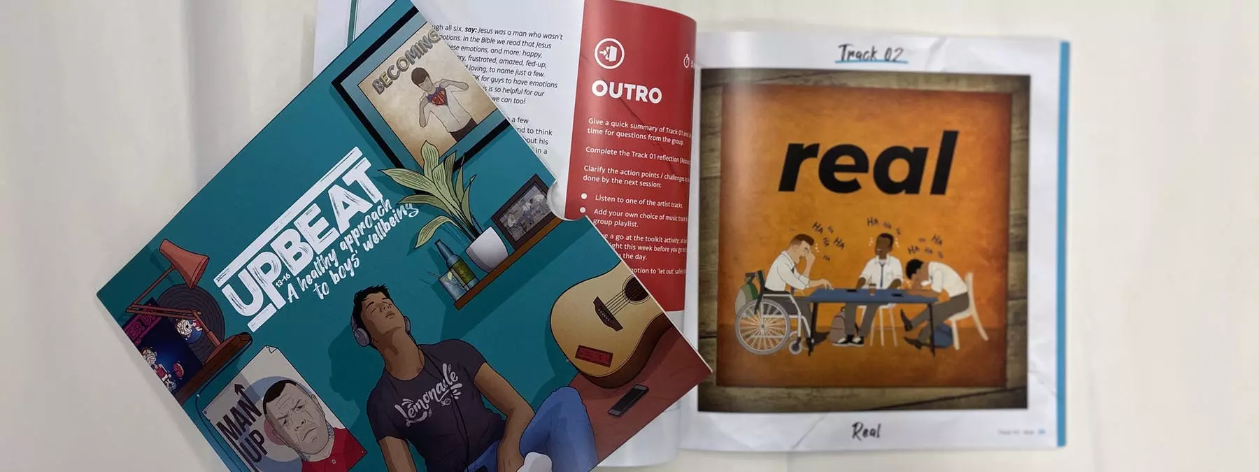 Photograph of Upbeat resource sleeve design and inside of book showing layout and illustration