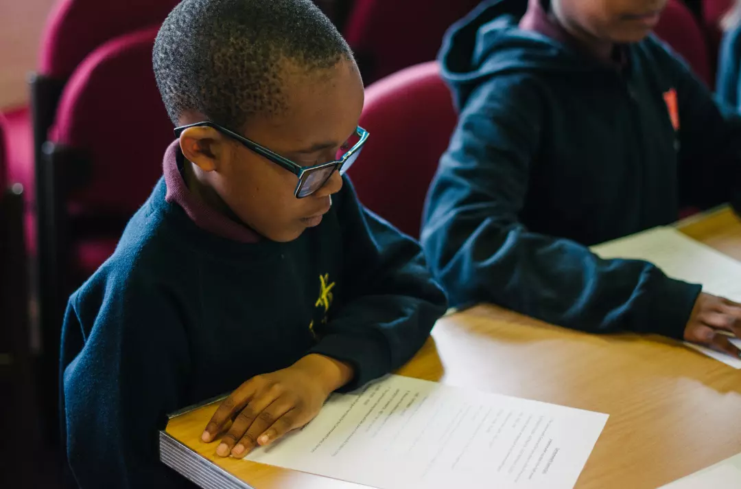 A child reading in a Salvation Army Sunday School class