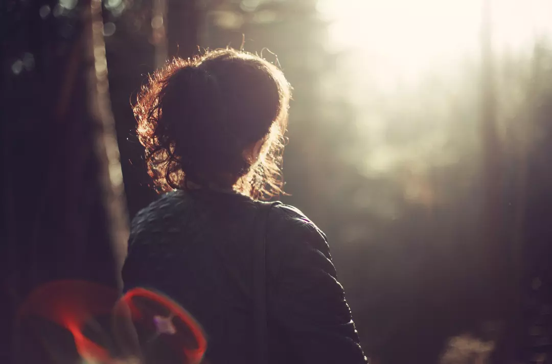 Someone sitting in a wood