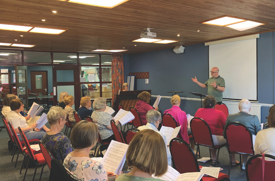 Bobby Irvine conducts the Easter Music Course singers