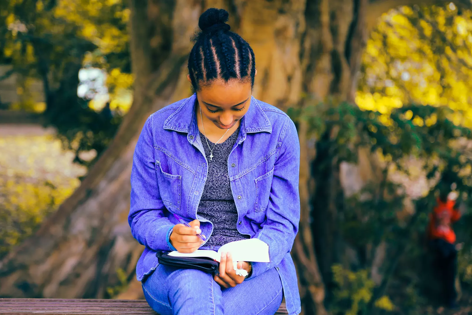 Woman sitting reading Bible