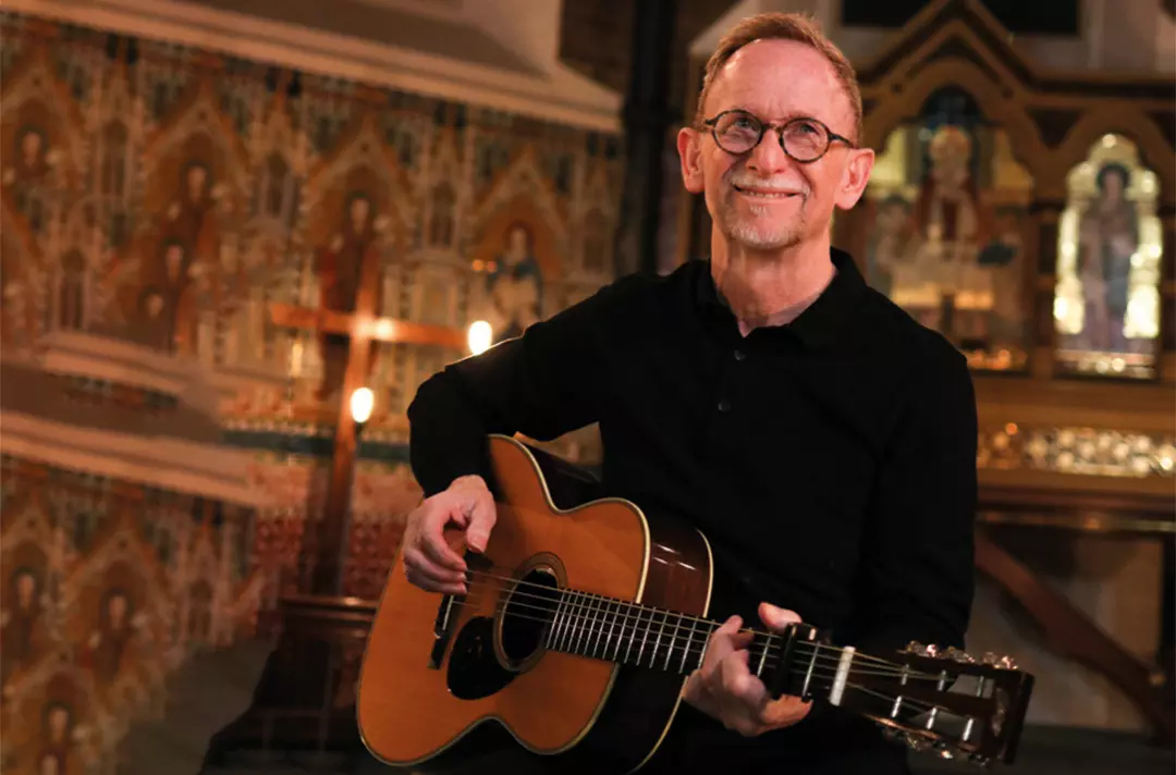 Graham Kendrick holding a guitar