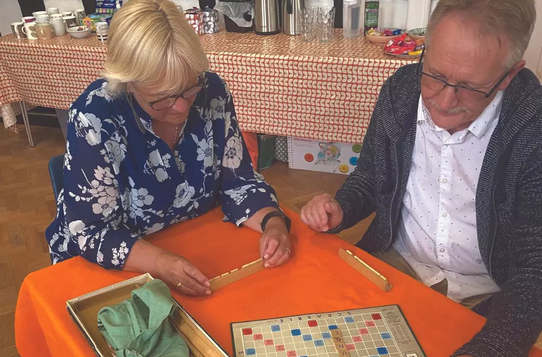 People playing Scrabble