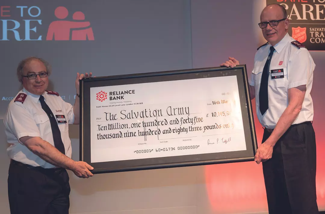 Lieut-Colonel Alan Read and Commissioner Anthony Cotterill hold the cheque from SATCoL