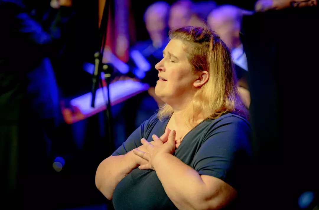 Someone doing British Sign Language on stage