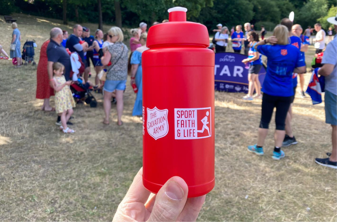 A water bottle with a Salvation Army red shield on it