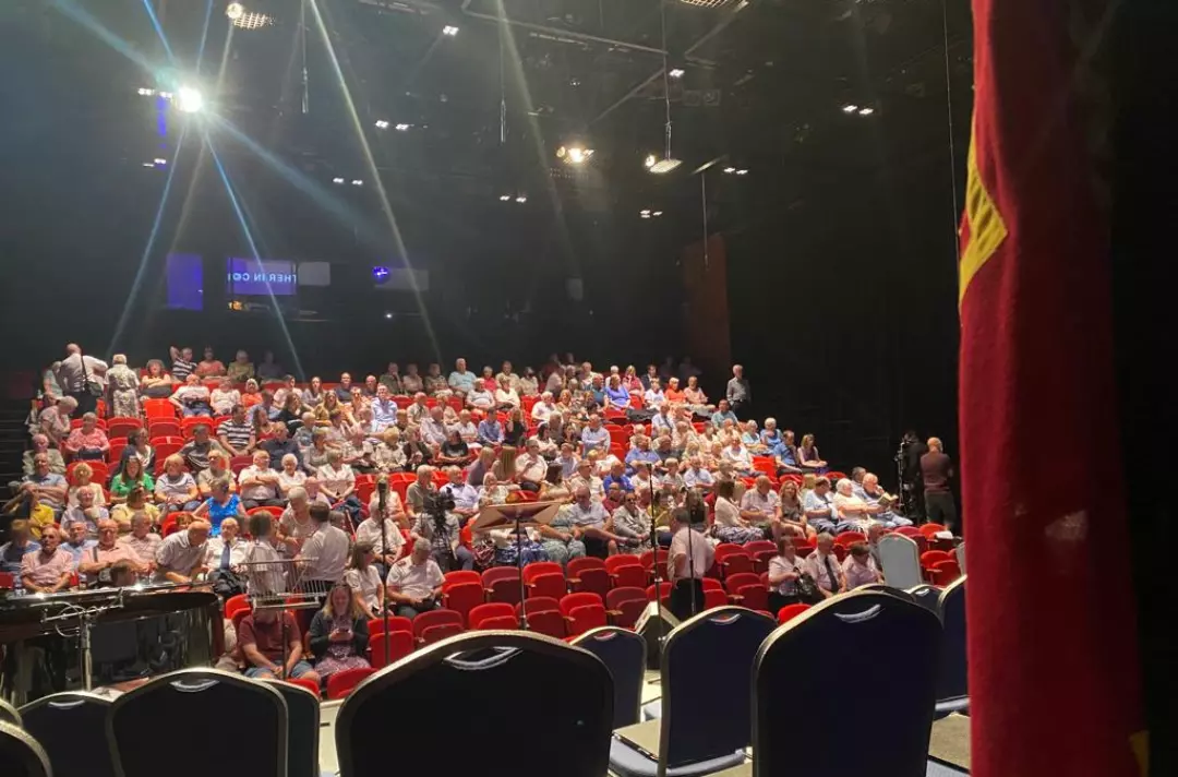The audience takes their seats for the concert