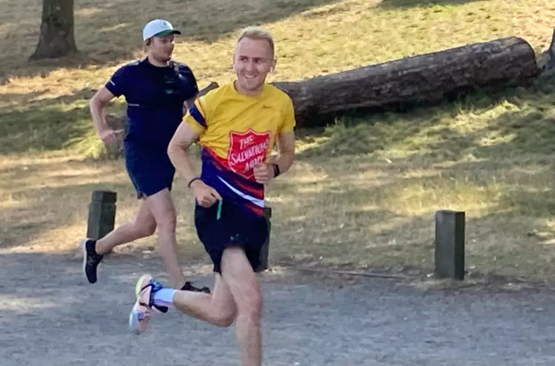 Someone running in a Salvation Army top