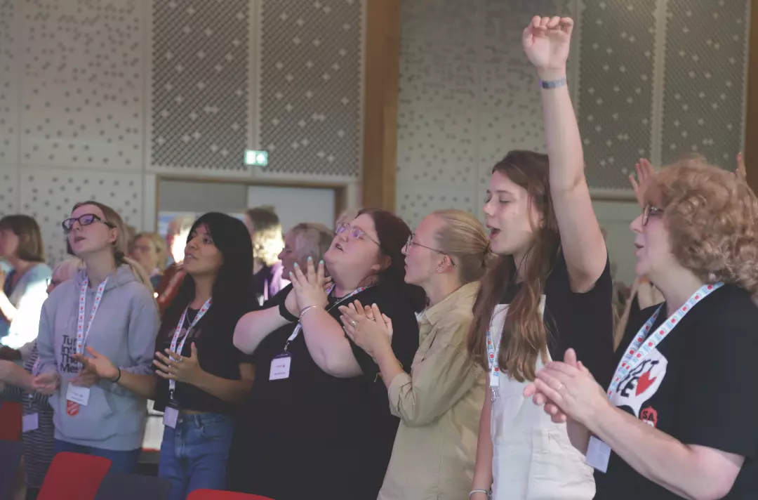 Women worshipping at Riverbank