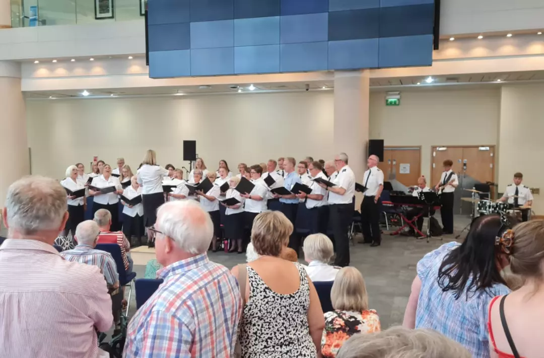 A choir performing in the foyer of the ICC