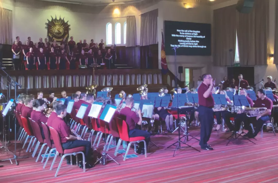 A congregational song led by a brass band