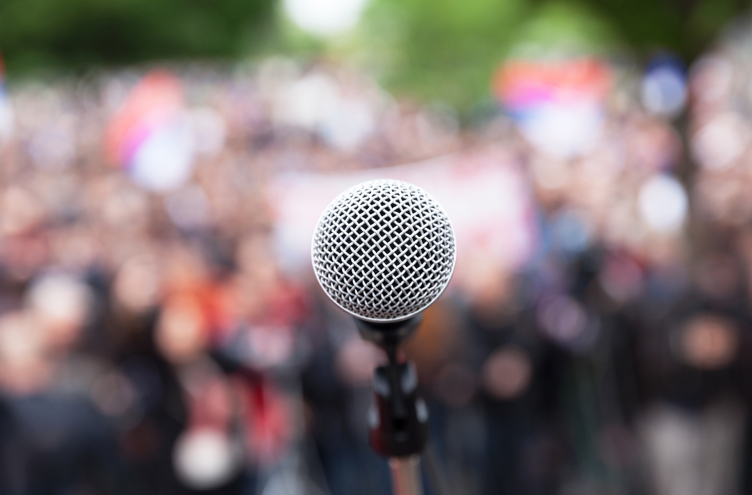 A microphone in front of a crowd