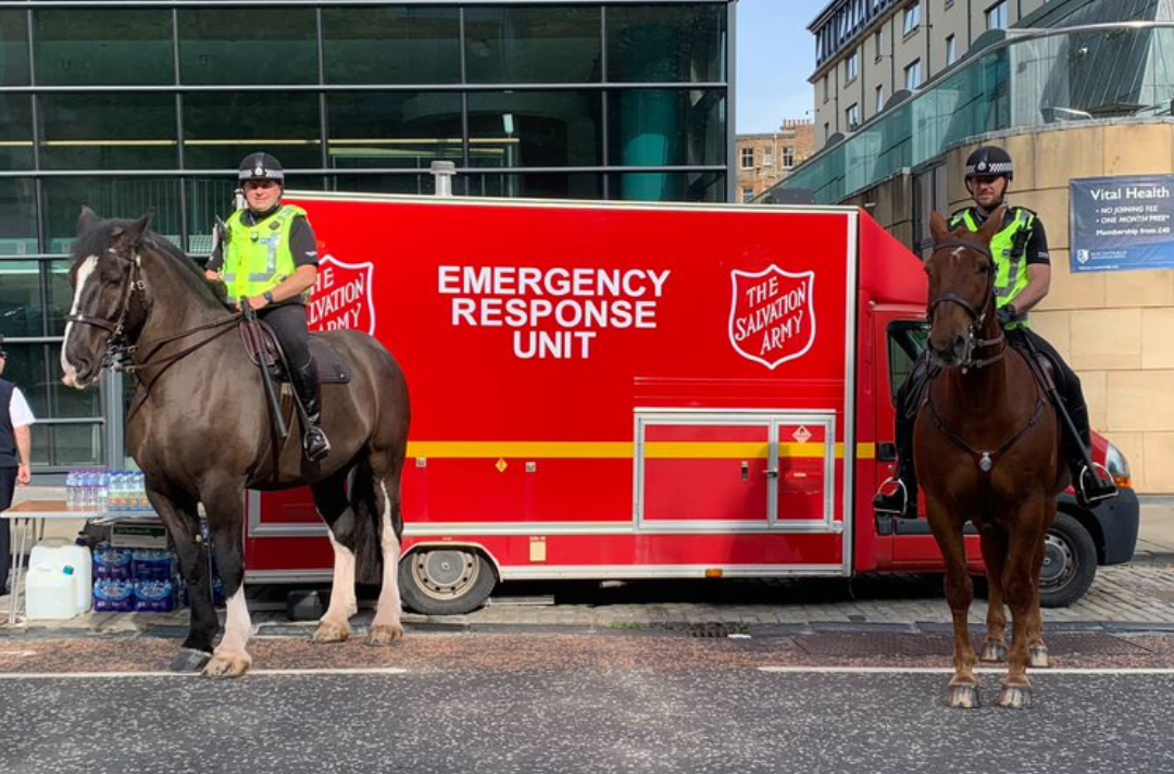 Mounted police by a Salvation Army emergency response unit