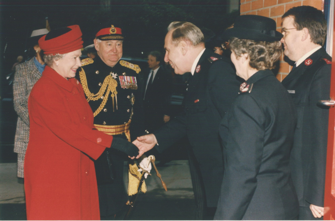 The Queen shaking hands with Salvationists in uniform