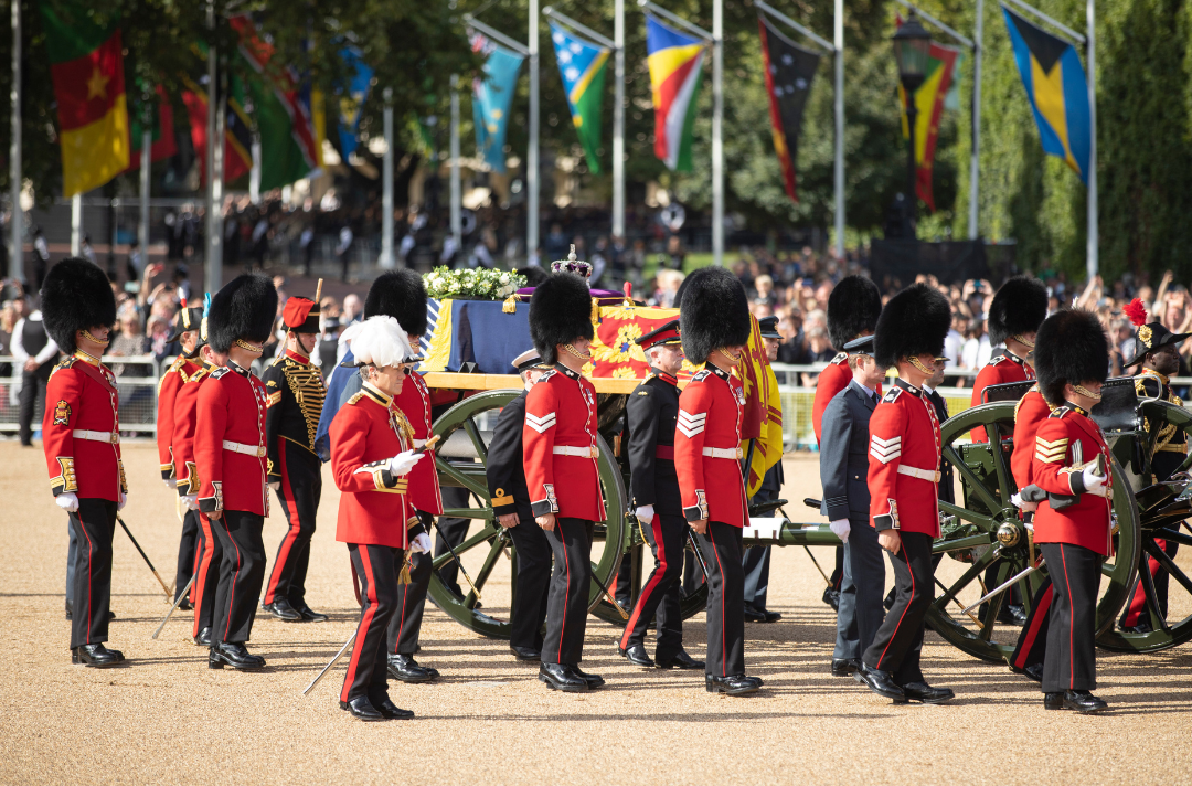 The Queen's coffin surrounded by a military guard