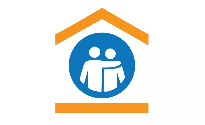 A logo showing two figures, one with their arm around the others should, inside a simplified drawing of a house.