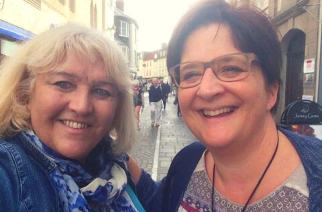 A selfie of Cathy and Debbie smiling in a high street