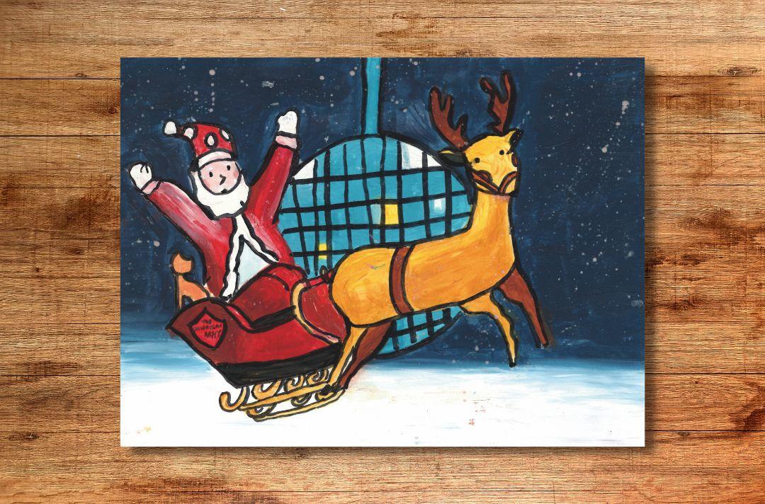 A Christmas card drawn by a child, featuring Father Christmas riding his sleigh with his hands in the air. The sleigh has a Salvation Army red shield on it and is being pulled by a reindeer.