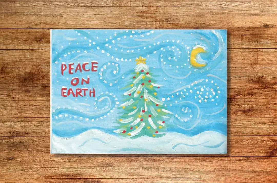 A Christmas card drawn by a child, featuring a Christmas tree in the snow on a windy night. The text reads 'peace on earth'