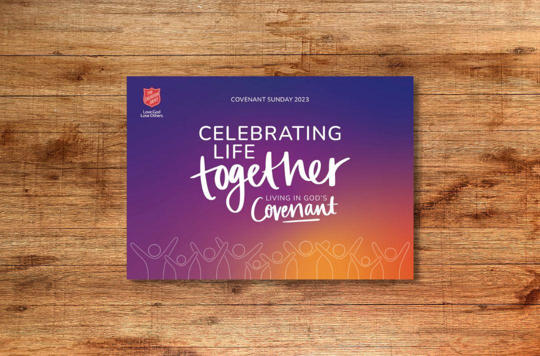 A photo of the Covenant Sunday post card, featuring a purple and orange gradient and the words 'Celebrating life together. Living in God's Covenant.'