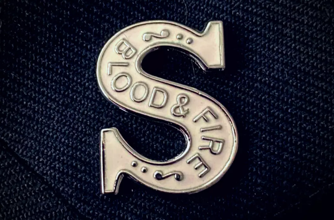 Photo shows a close up of a soldier's uniform.