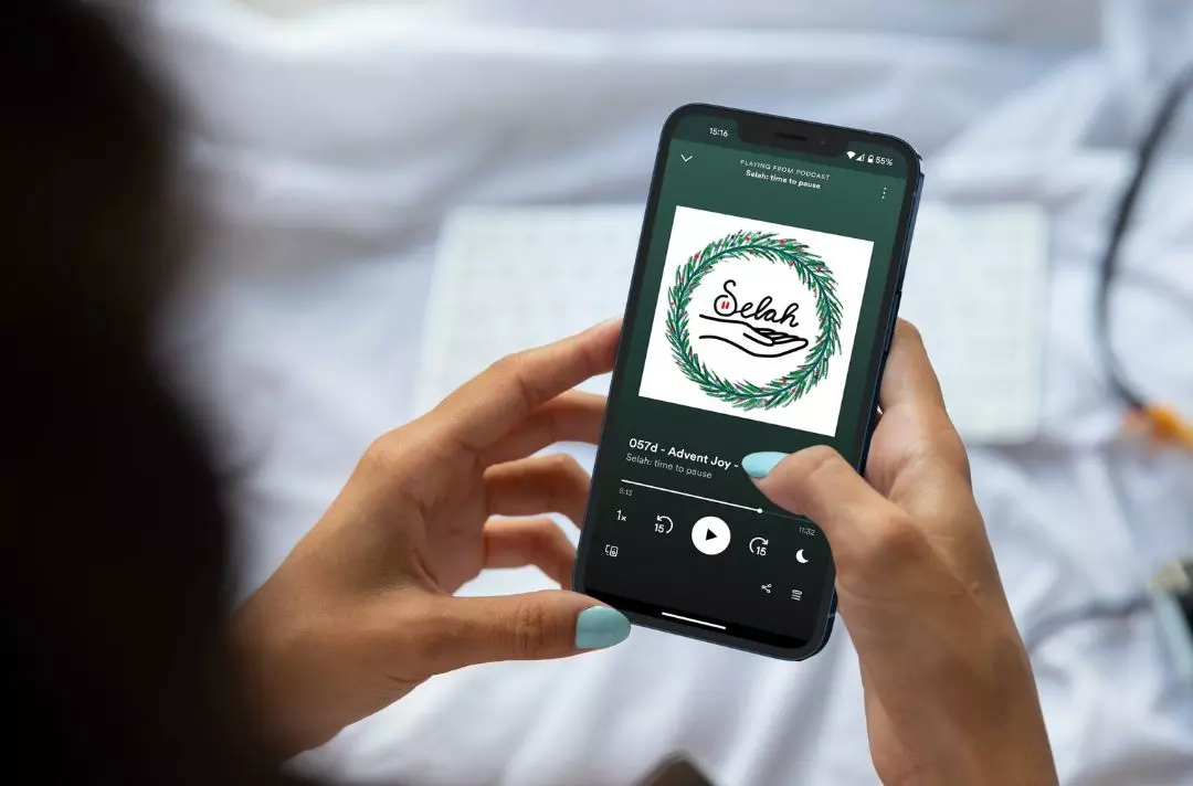 Photo shows a smartphone displaying the Selah podcast alongside a keyboard