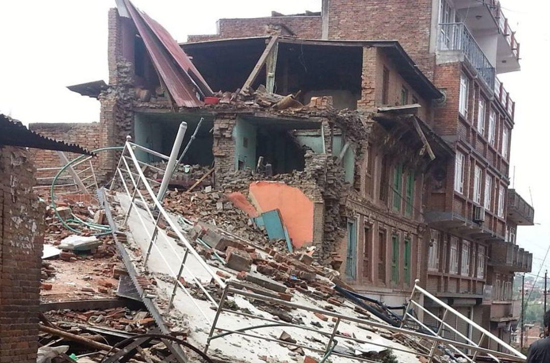 A photo of the a brick building destroyed by an earthquake