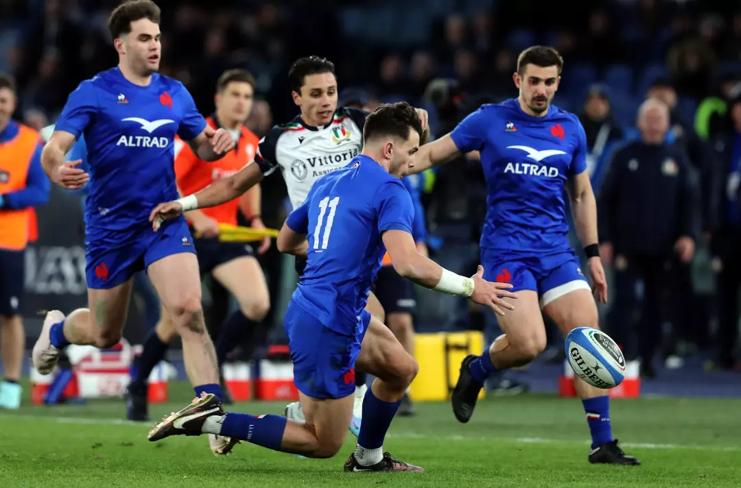 Photo shows people playing rugby.