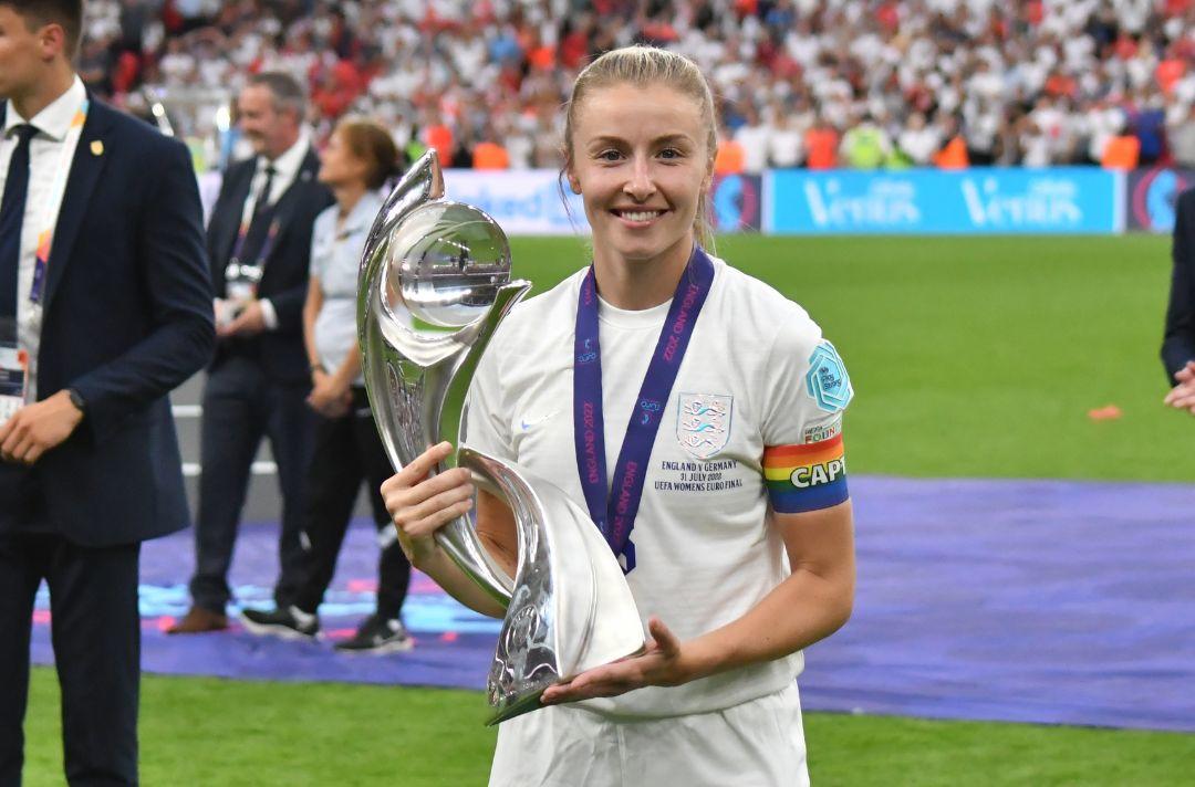 A photo of England women's captain Leah Williamson holding the Women's Euro 2022 trophy