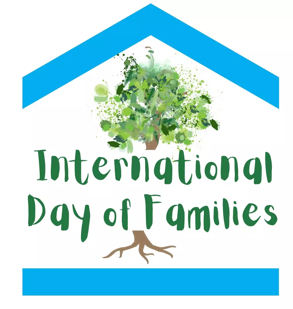 blue house with green text and a tree behind