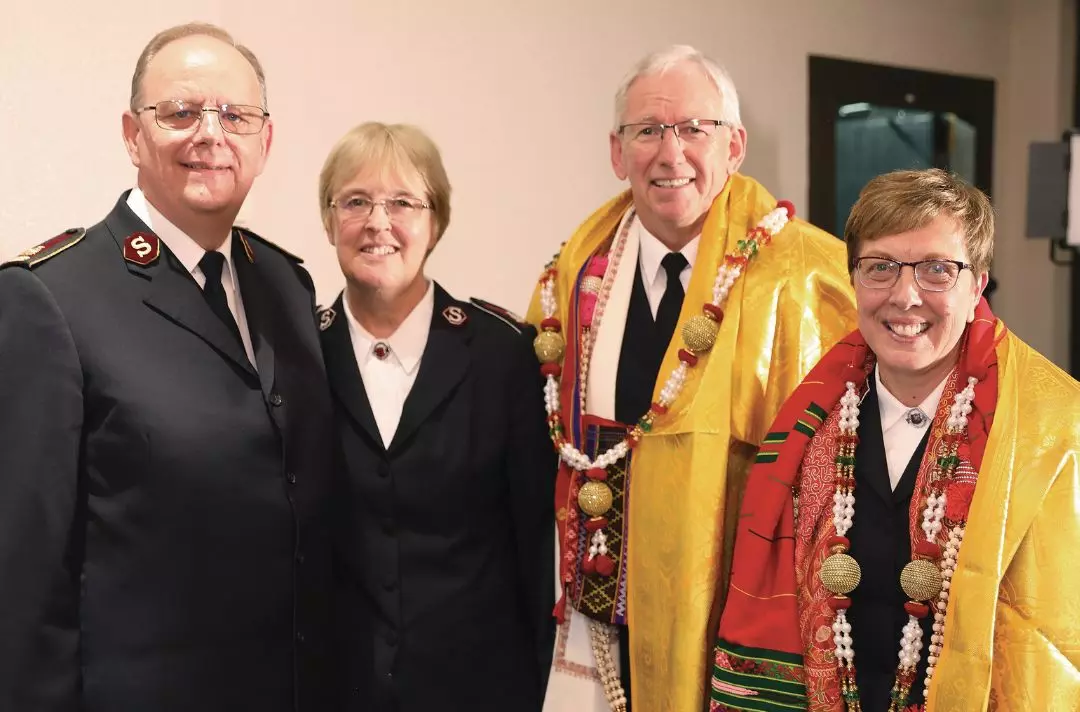 A photo of General Andre Cox and Commissioner Sylvia Cox with General Brian Peddle and Commissioner Rosalie Peddle