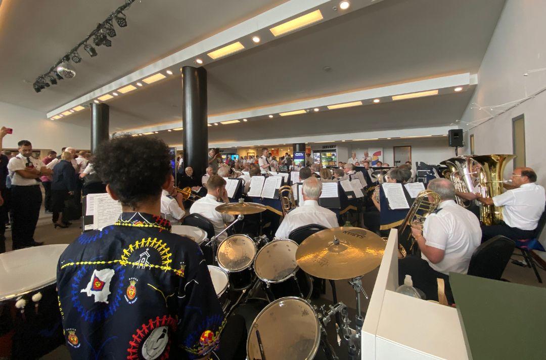 A photo of Staines Band brass band playing in the foyer of Fairfield Halls