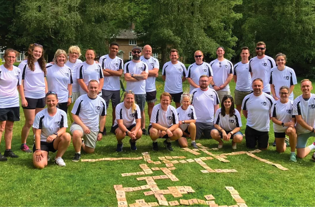 Photo shows the delegates of Sport Faith Life posing for a photo wearing matching white shirts.