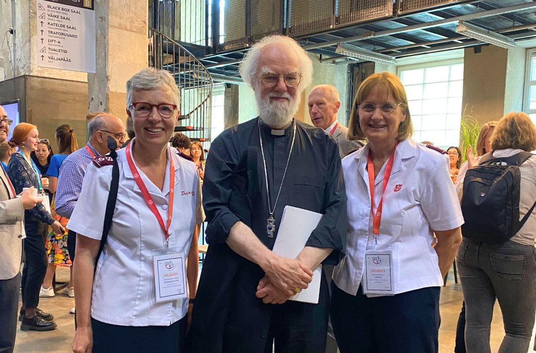 A photo shows Commissioner Vibeke Krommenhoek and Commissioner Jane Paone with the Rt Rev Rowan Williams