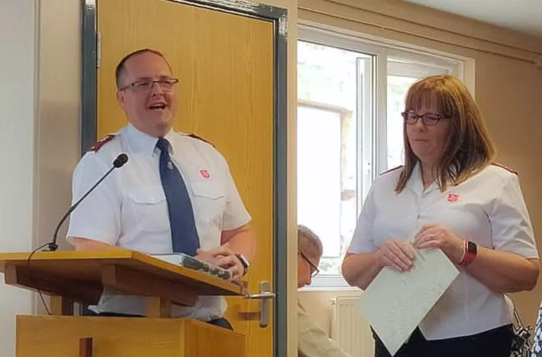 A photo shows Captain Clare and Lieutenant Jamie Jones laughing together.