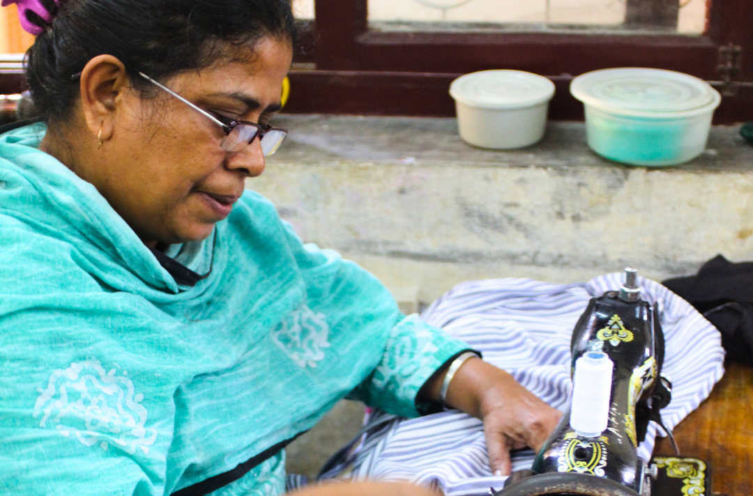 A photo shows someone working at a sewing machine.