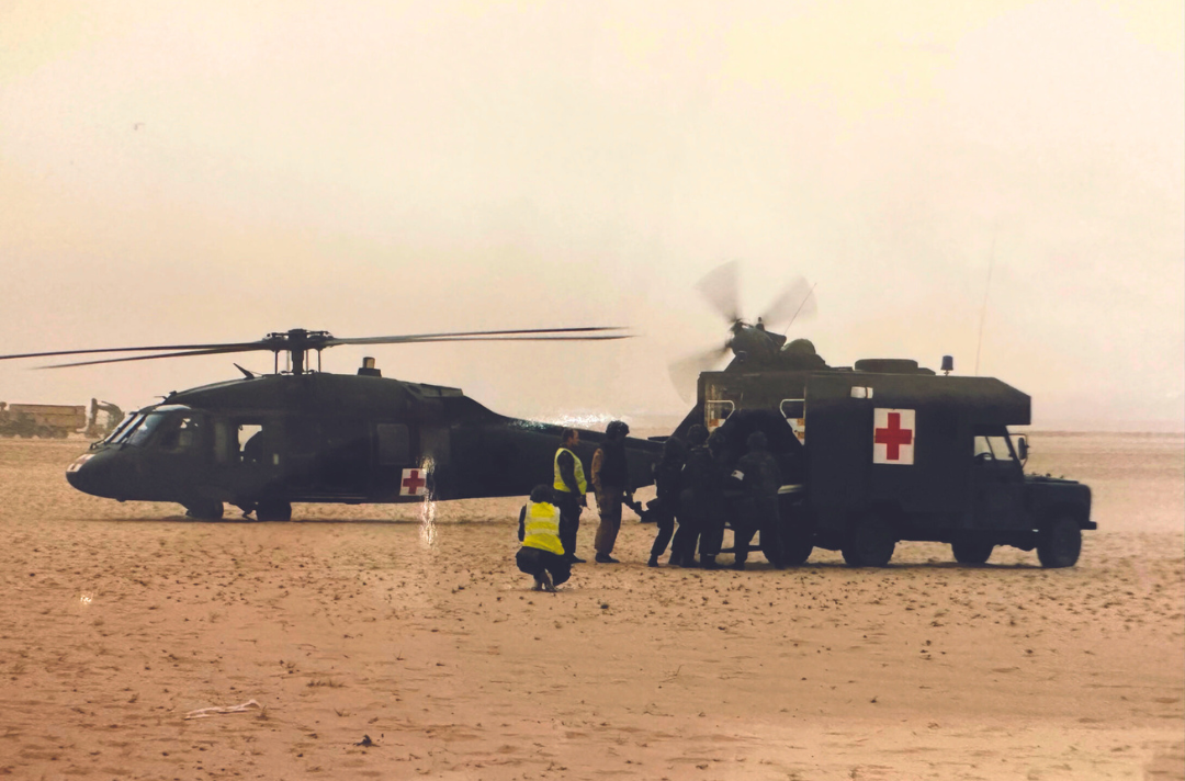 A photo shows casualty evacuation training in Iraq with American Black Hawk Helicopters, 2003.
