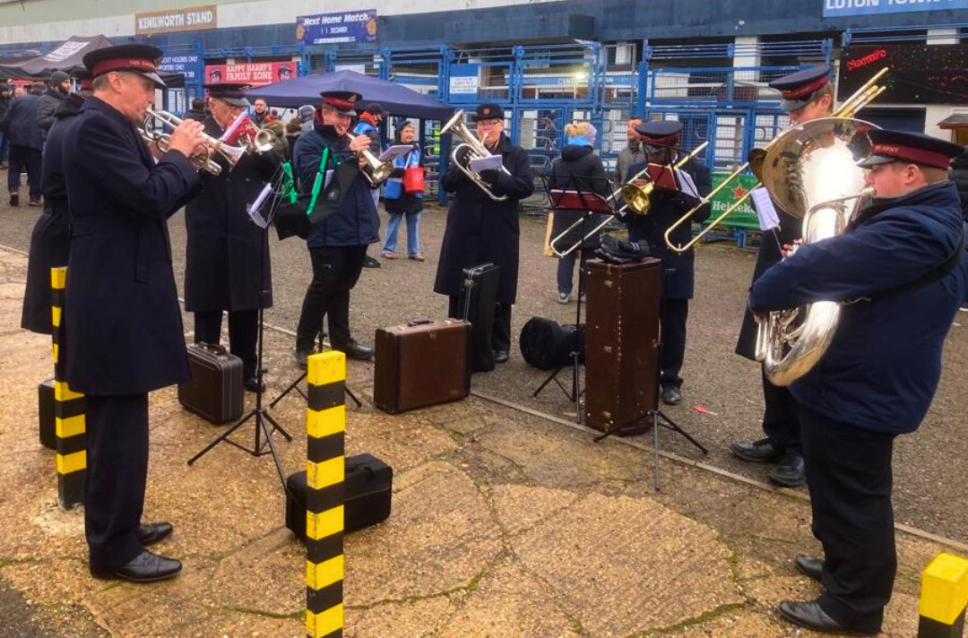 A photo shows Luton band playing music on the street.
