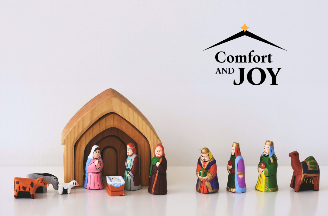 A photo shows a wooden manger scene with a baby Jesus, Mary, Joseph, shepherd, animal and Magi figures. Text reads: Comfort and joy.