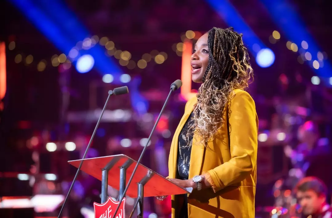 A photo of Joanna Adeyinka-Burford reading the Bible on stage at the Royal Albert Hall