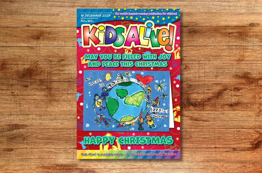 A graphic shows the cover of Kids Alive! 16 December proudly featuring Hadrian's Christmas card design.
