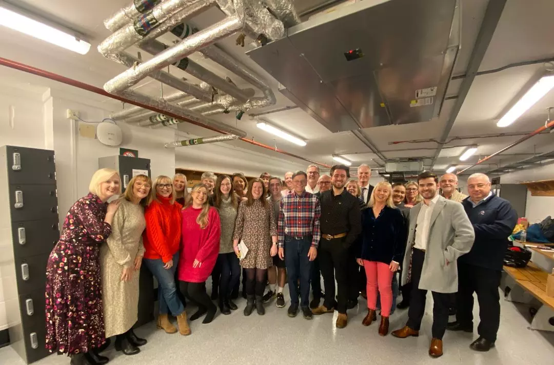 A group photo of the International Staff Songsters backstage at the Royal Albert Hall