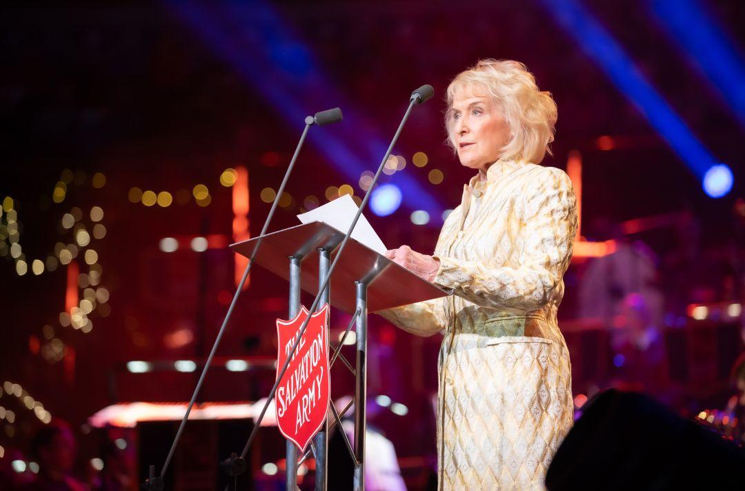 A photo of Rosemary Conley reading the Bible on stage at the Royal Albert Hall