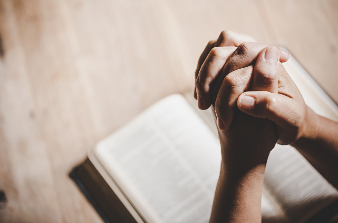 A photo of praying hands