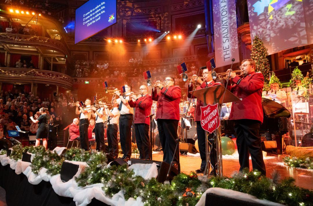 A photo of eight Salvation Army trumpets lining the front of the stage of the Royal Albert Hall