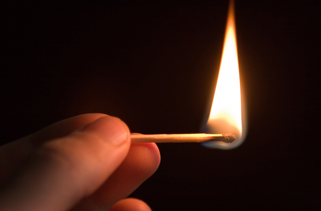 A photo of someone holding a match