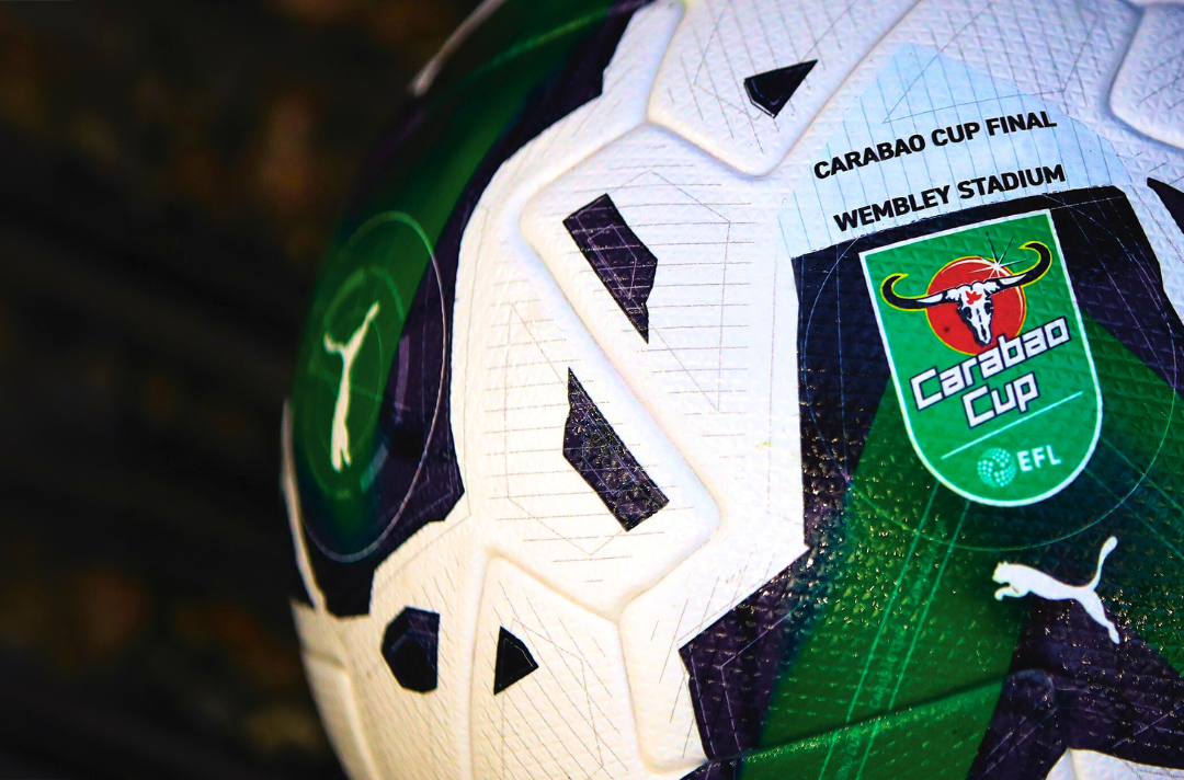 A photo shows a close-up of a football from the Carabao Cup.